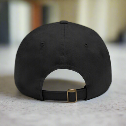 Black cap with a gold buckle on a white background