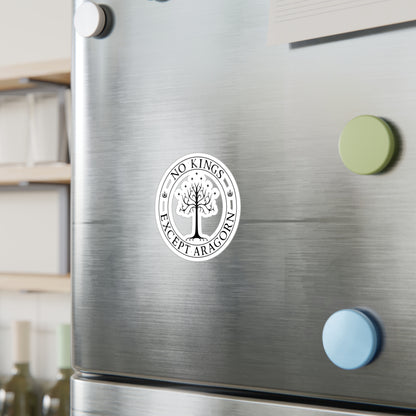 Circular sticker with the text "No kings except Aragorn" and a graphic of a white tree with seven stars above it and the crown of the king of Gondor. The sticker is shown on a refrigerator door.