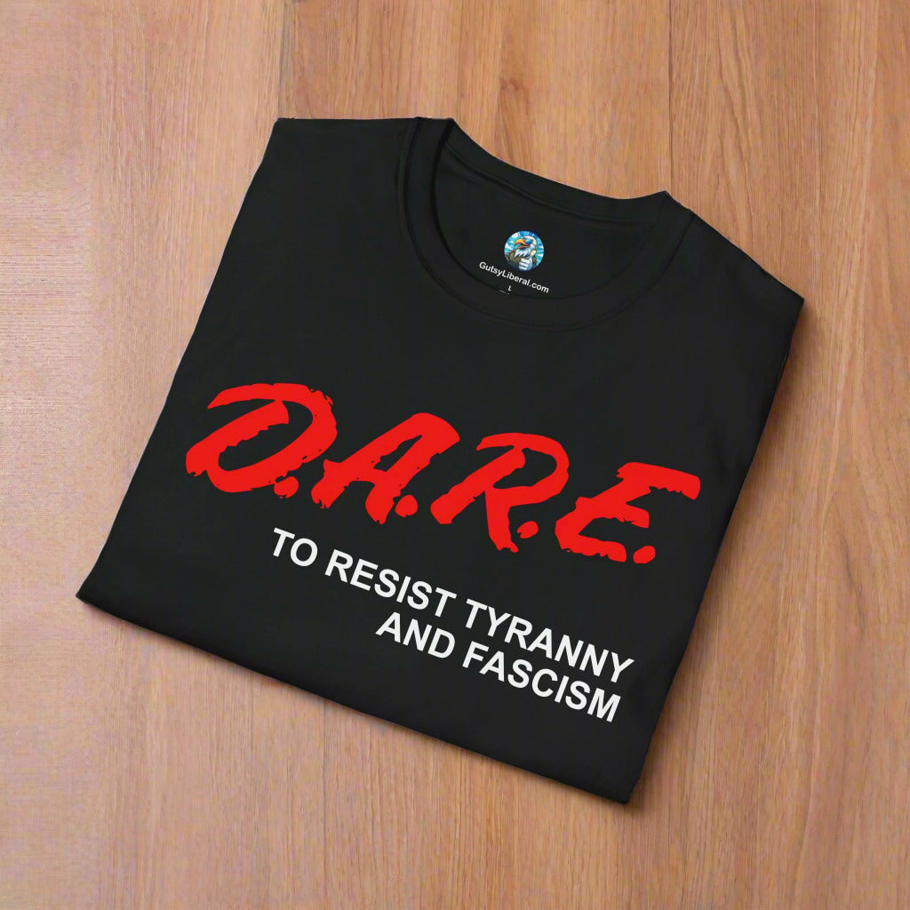 Black t-shirt with red and white text on a wooden surface