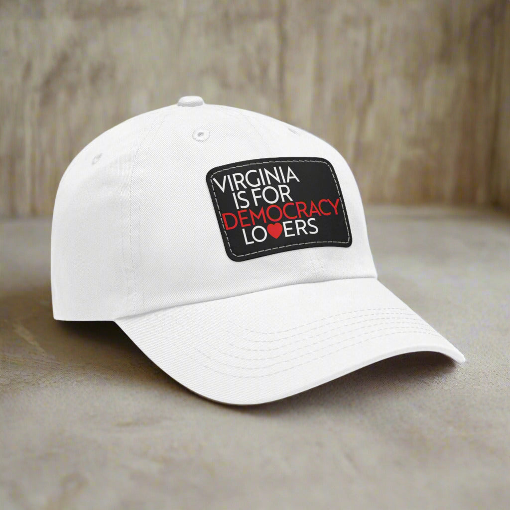 White cap with 'Virginia is for Democracy Lovers' text on a white background