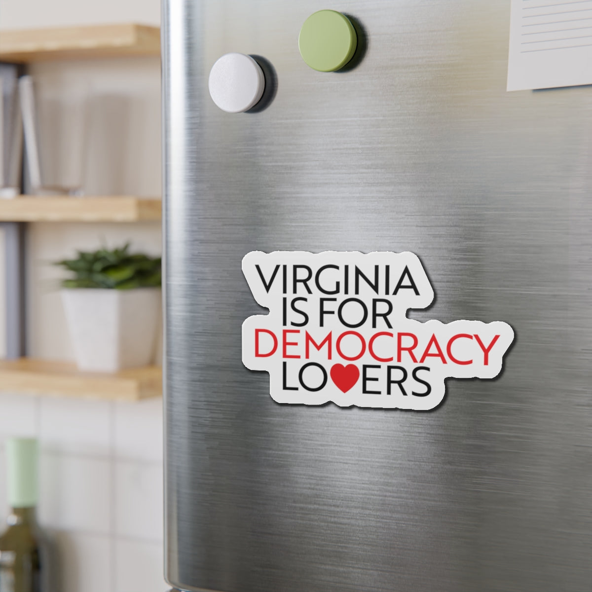Fridge magnet with 'Virginia is for Democracy Lovers' text on a metallic surface.