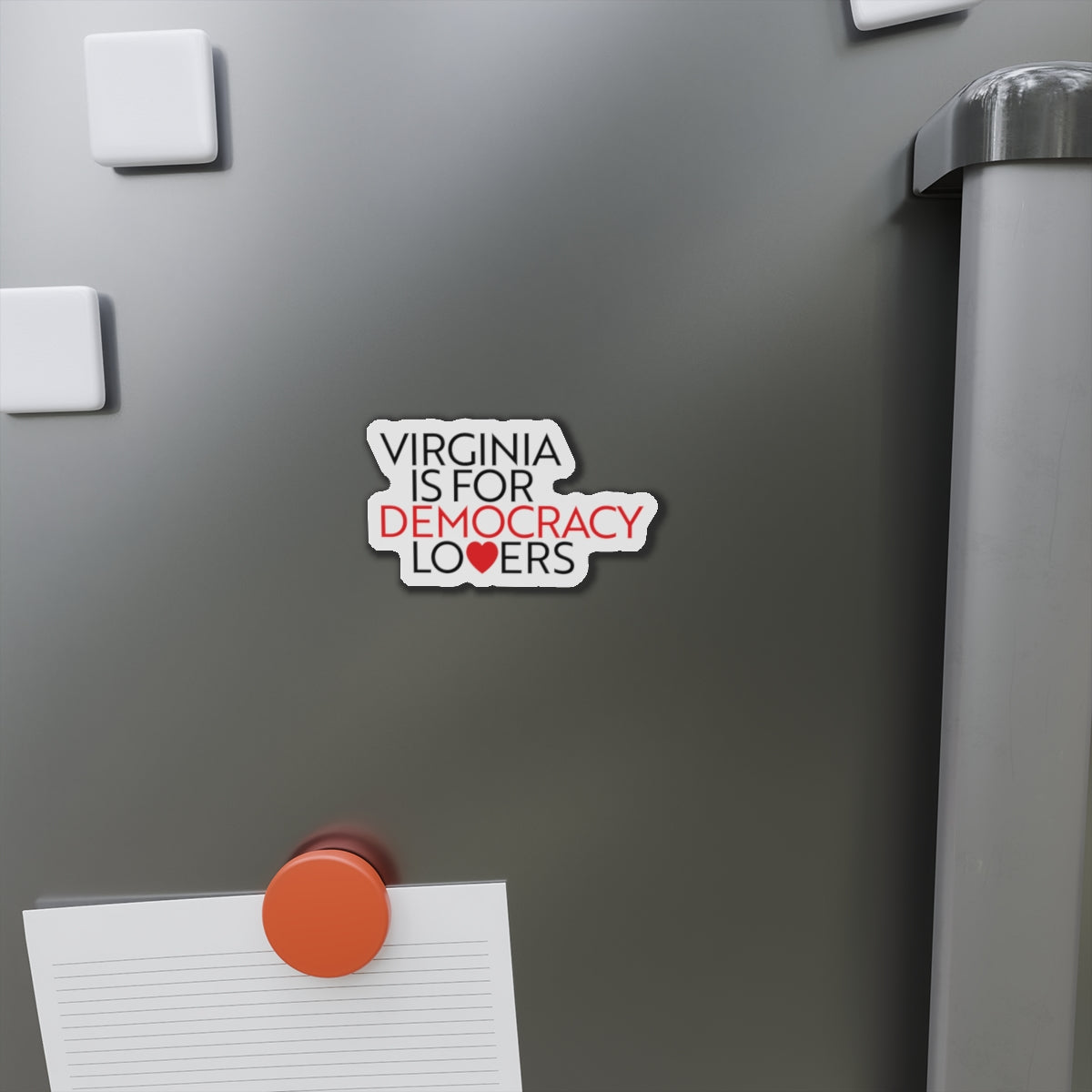 Magnet on a refrigerator door with text 'Virginia is for democracy lovers'.