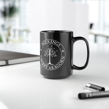 Black mug with the text "No kings except Aragorn" and a graphic featuring the white tree of Gondor with seven stars above it and the kings' crown.
