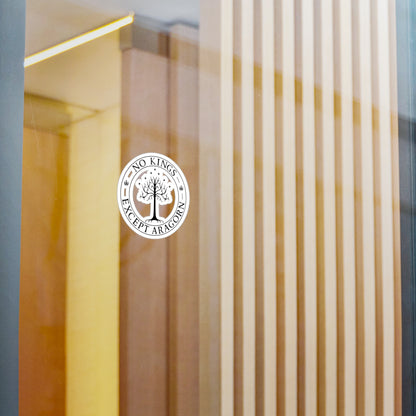 Circular sticker with the text "No kings except Aragorn" and a graphic of a white tree with seven stars above it and the crown of the king of Gondor. The sticker is shown on glass.