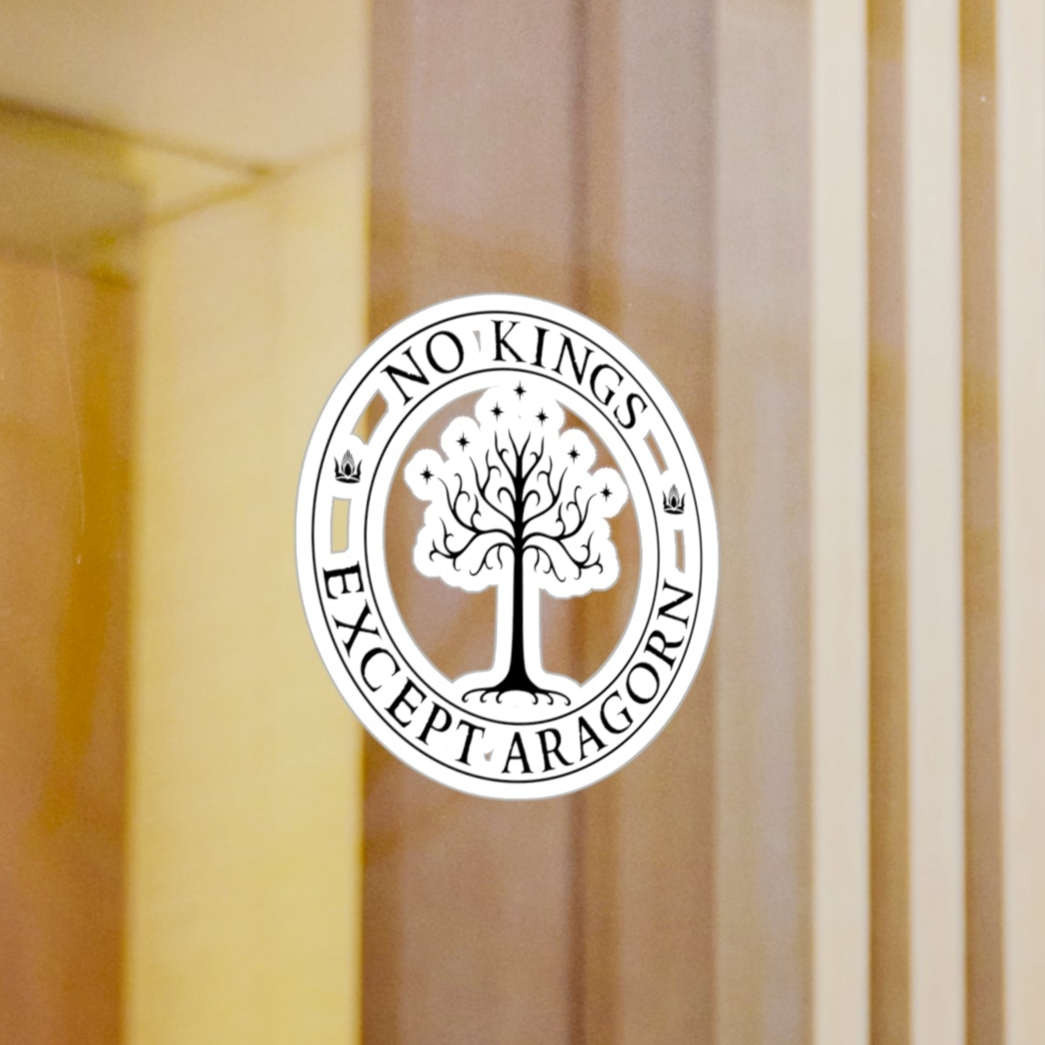 Circular sticker with the text "No kings except Aragorn" and a graphic of a white tree with seven stars above it and the crown of the king of Gondor.