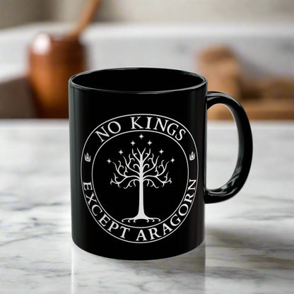 Black mug with the text "No kings except Aragorn" and a graphic featuring the white tree of Gondor with seven stars above it and the kings' crown.