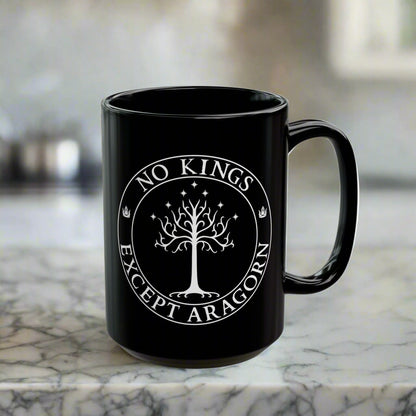 Black mug with the text "No kings except Aragorn" and a graphic featuring the white tree of Gondor with seven stars above it and the kings' crown.